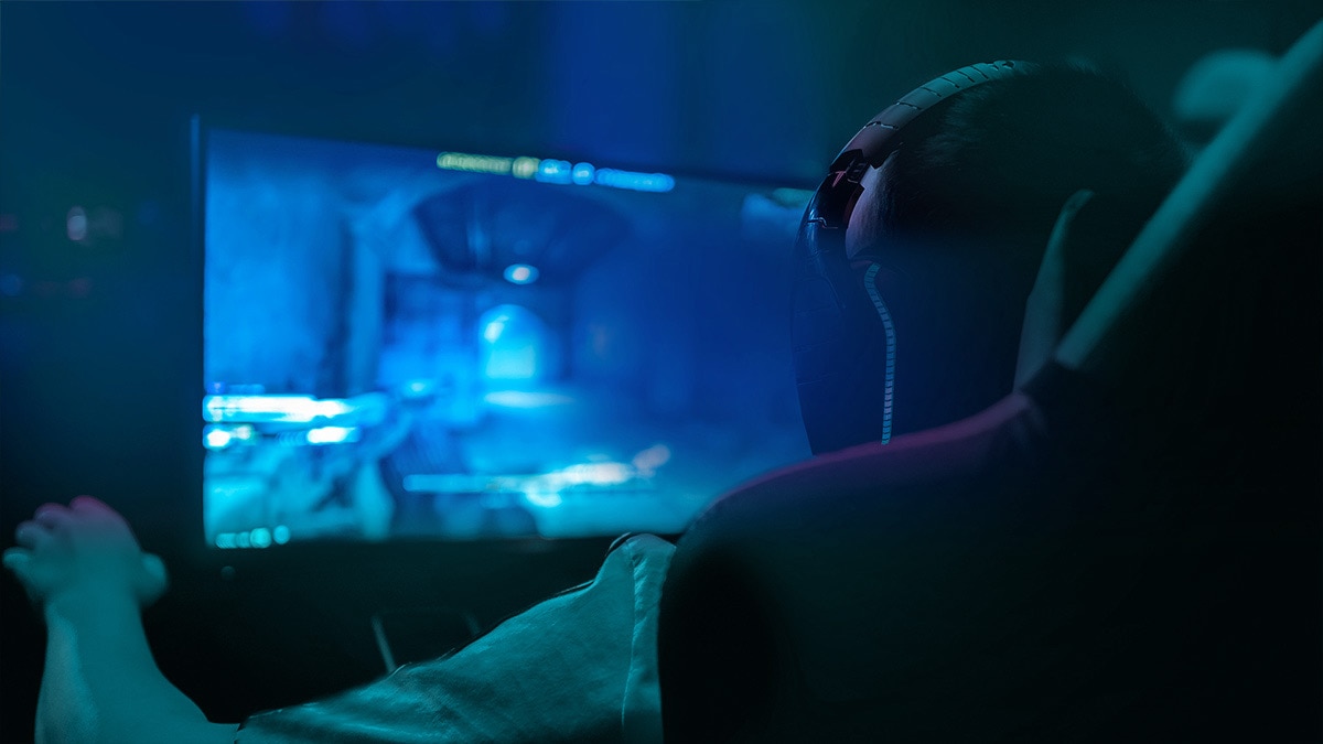 Close-up Back view of Male gamer playing video games Close-up Back view of Male gamer playing video games