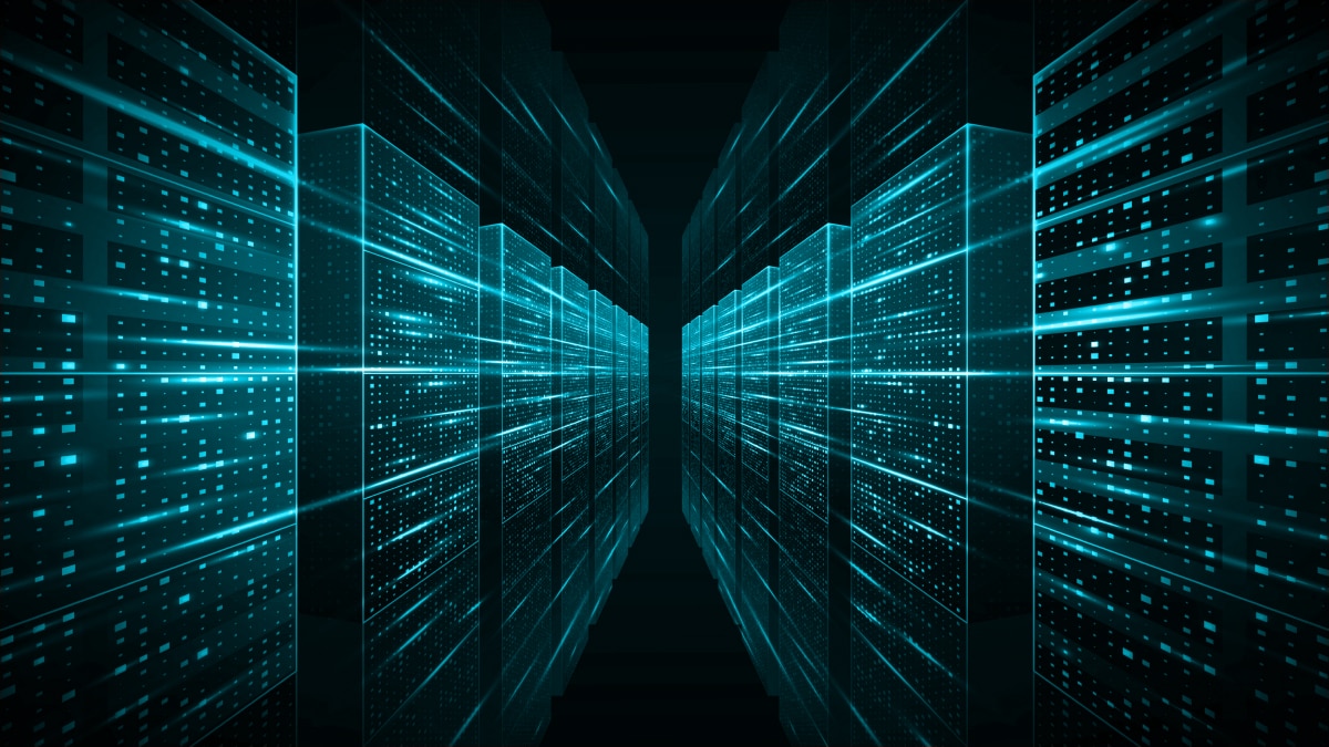 Abstract view of a data center with glowing blue-teal server racks and data lines receding into a dark background.