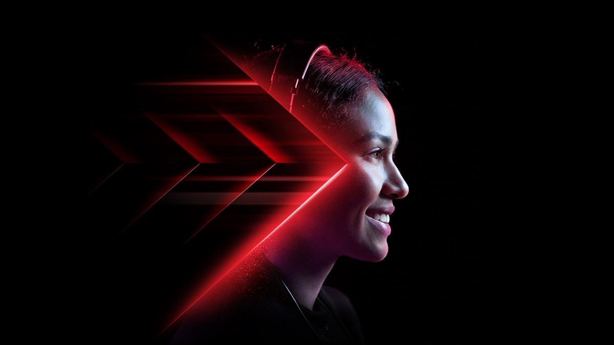 Woman Wearing Gaming Headset: Stylish Design Enhanced by Red Lighting Against a Dark Background