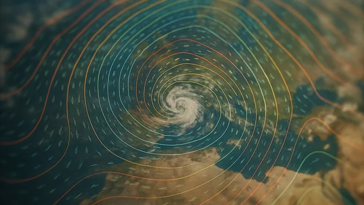 Satellite-style view of a hurricane over ocean with colorful contour lines and wind flow patterns spiraling around the storm center