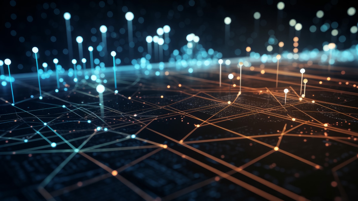 Glowing blue and orange nodes connected by lines across a digital grid, representing data networks and connectivity
