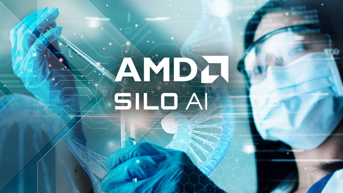 Scientist wearing protective eyewear, mask, and gloves handling a test tube in a lab with overlaid digital graphics and visible text "AMD SILO AI"