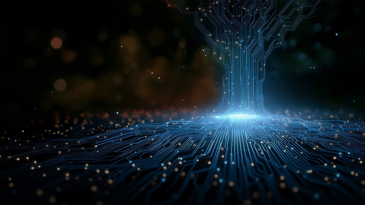 Glowing blue circuit traces form a tree shape rising from a microchip-like surface in a dark setting