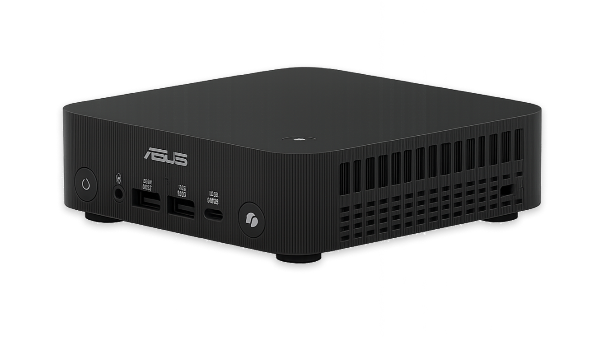 Black ASUS mini PC with front power button, audio jack, USB ports, and side ventilation, shown on a reflective surface.