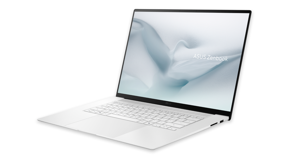 Silver ASUS Zenbook laptop open at an angle with thin bezels and light abstract wallpaper on screen.
