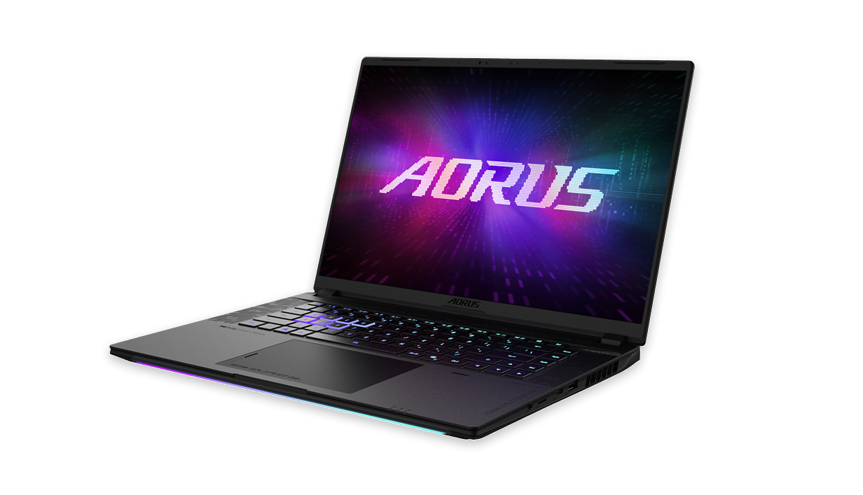 Black AORUS gaming laptop open with RGB backlit keyboard and colorful AORUS logo displayed on screen.