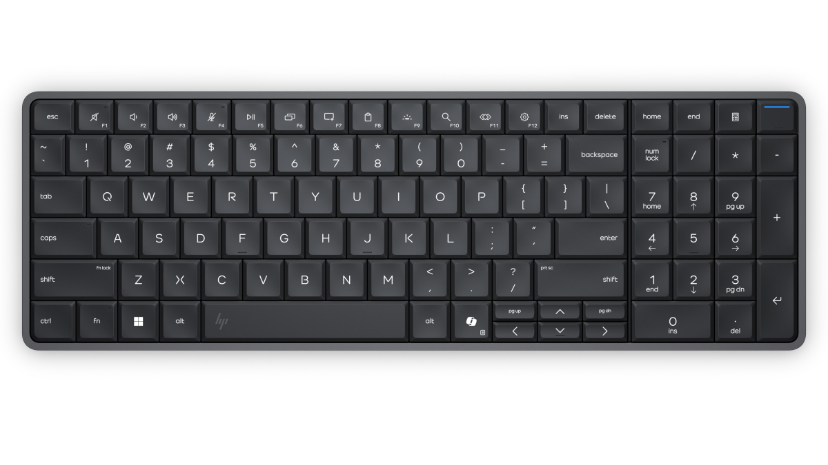 Black full-size keyboard with numeric keypad, low-profile keys, and standard QWERTY layout on dark background.