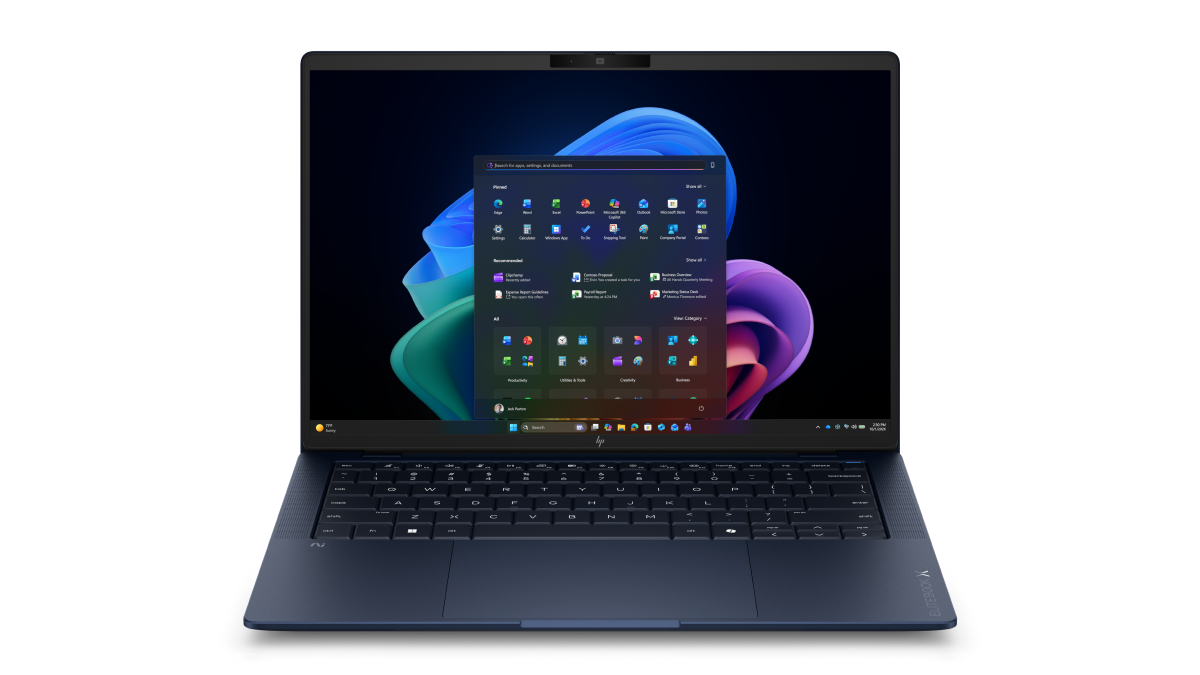 Dark blue HP laptop open showing Windows 11 Start menu and taskbar centered on the display.