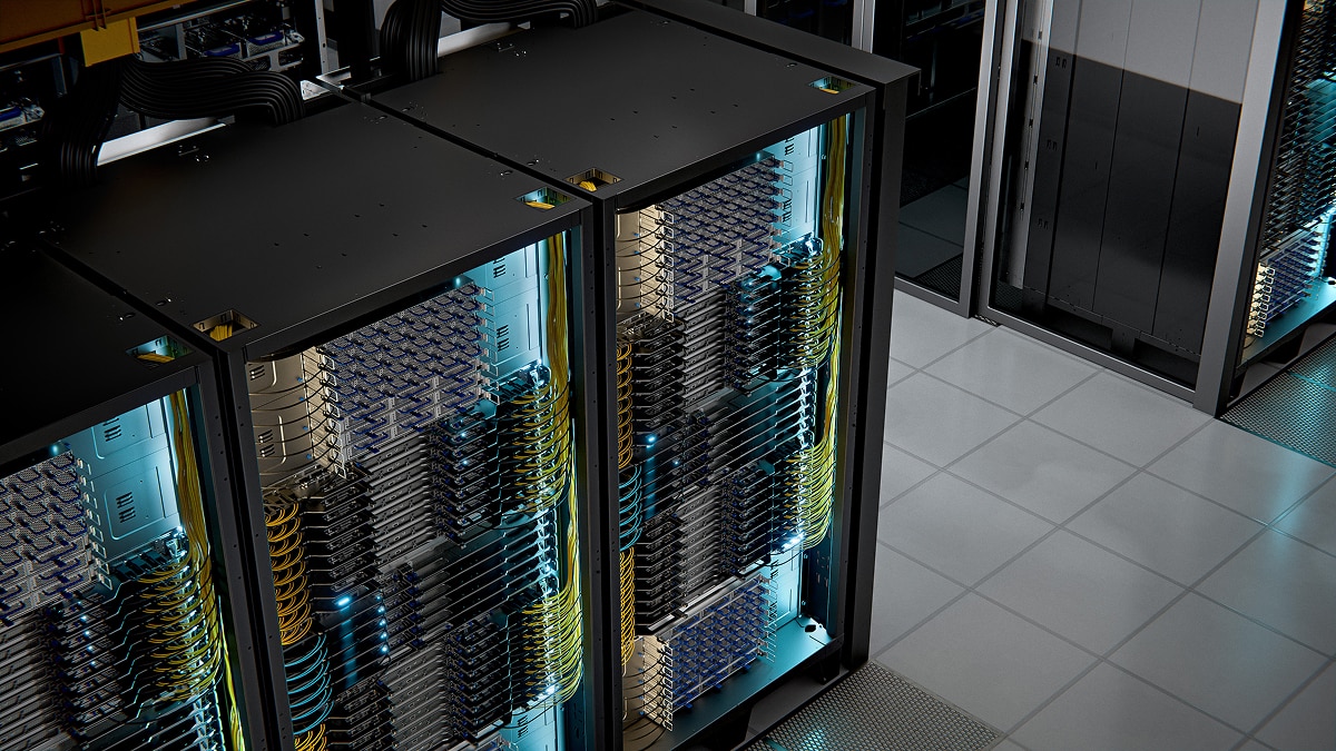 Rows of illuminated server racks with visible networking cables and hardware in a modern data center.