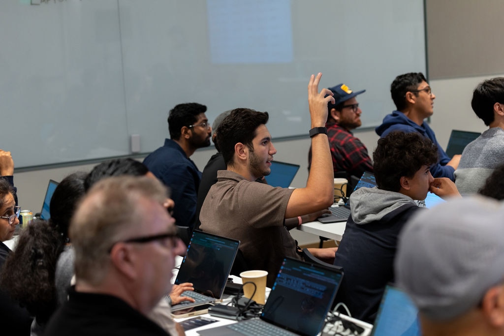 People Brown Shirt Raising Hand in Classroom, Laptops