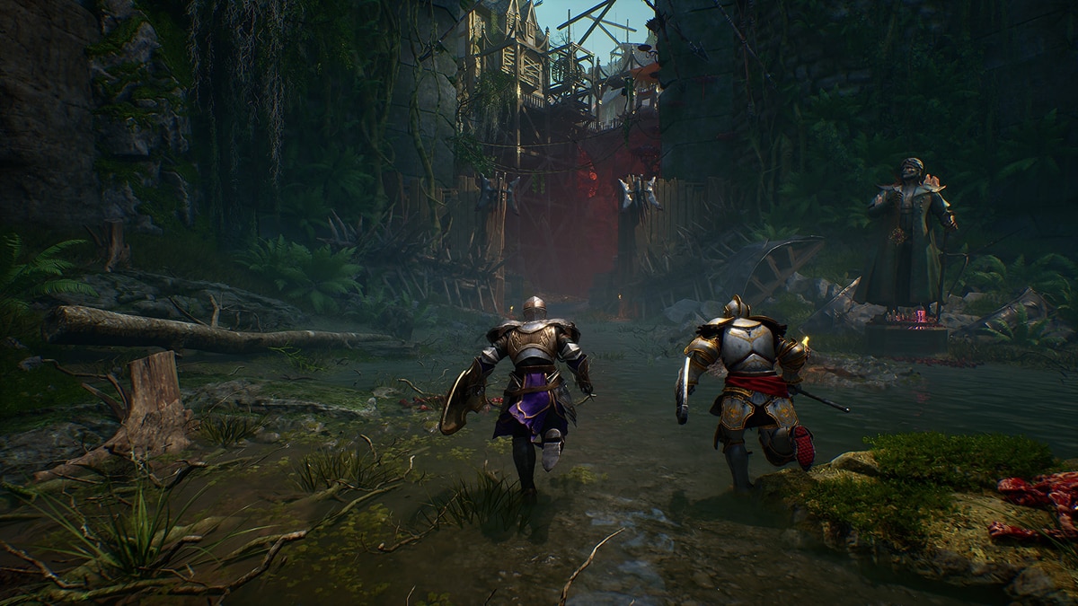 Two armored warriors run through a dark forest ruin toward a wooden barricade and robed figure.