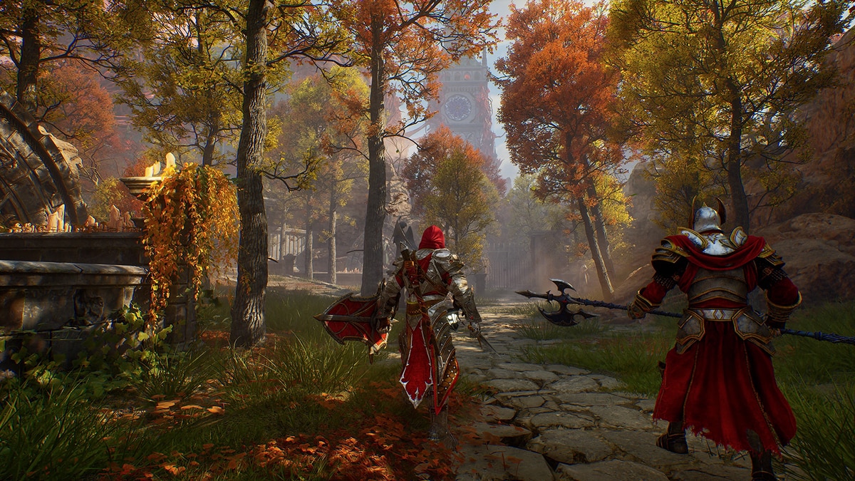 Two red-armored warriors walk a stone path through autumn woods toward Gothic ruins.