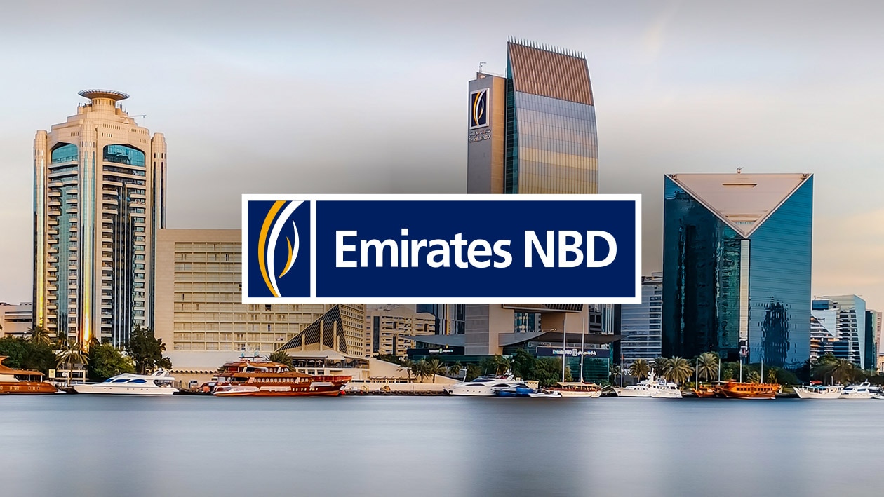 Financial Services: Emirates NBD Bank Image showing Emirates NBD bank logo with city skyline and Emiratres NBD office building in the back