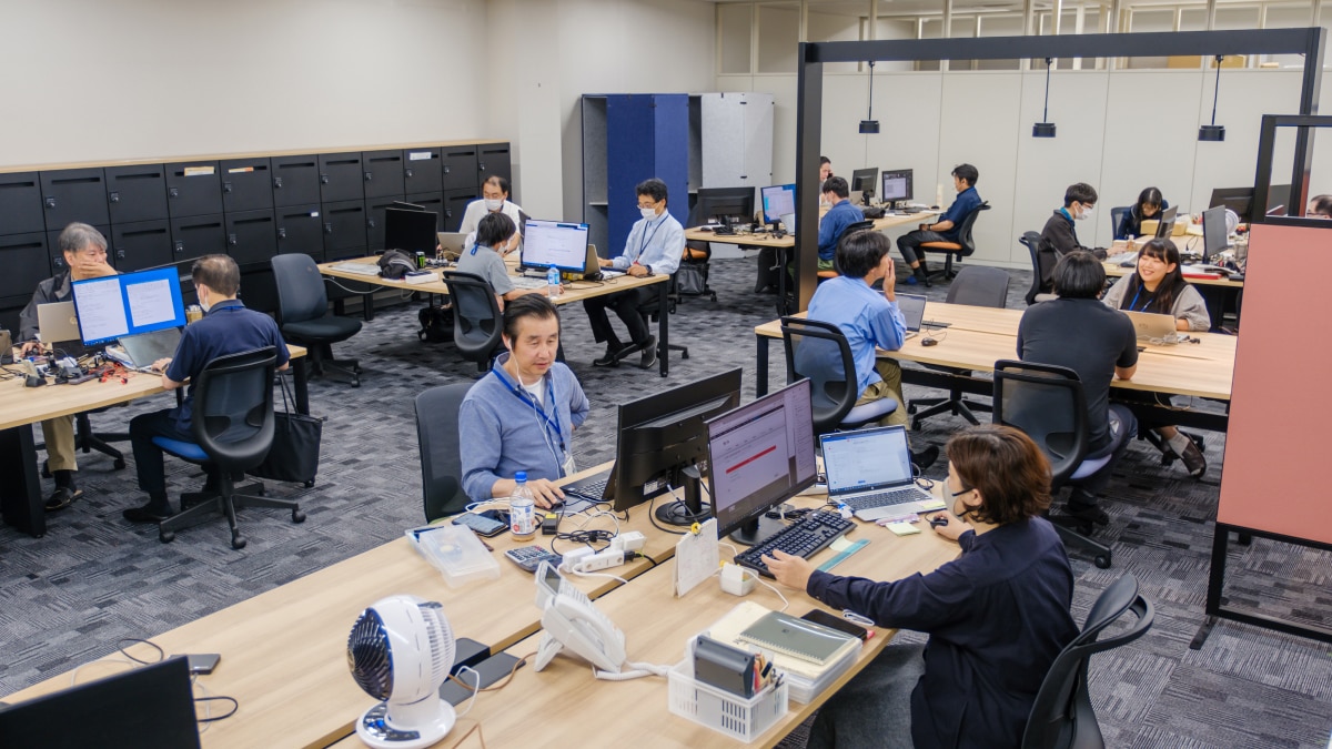 Employees in an office working on their computers