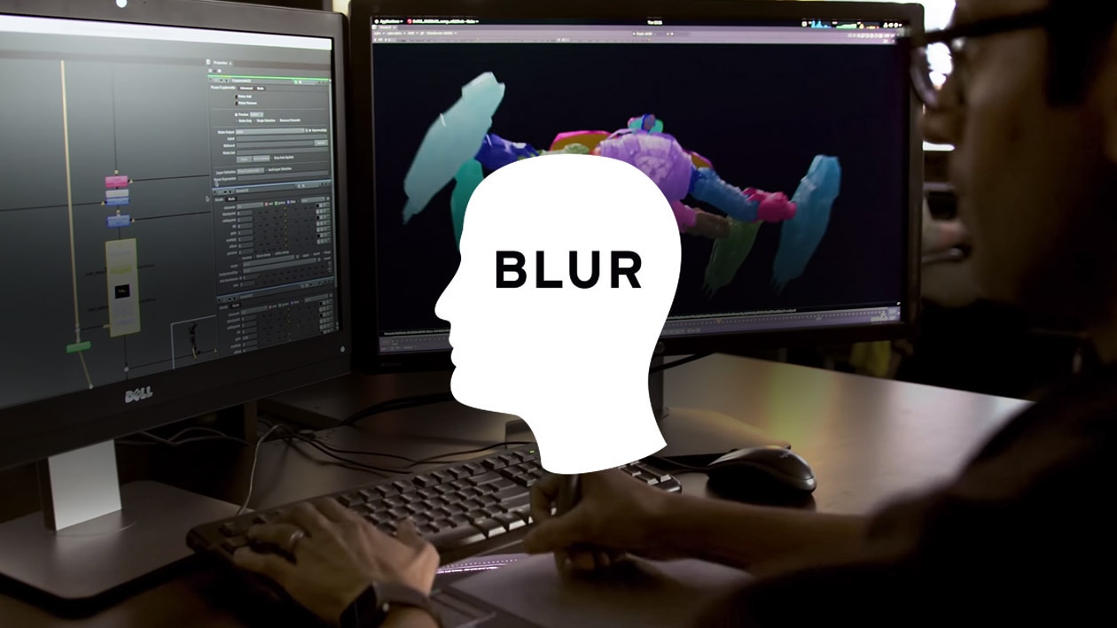 Blur Studio logo over image of man looking at computer monitors