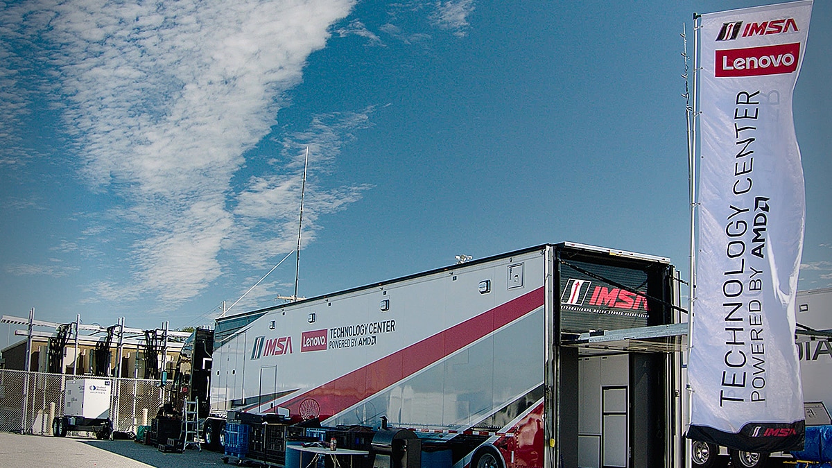 IMSA Lenovo Technology Center trailer powered by AMD, showcasing advanced computing and data solutions for real-time motorsport analytics.