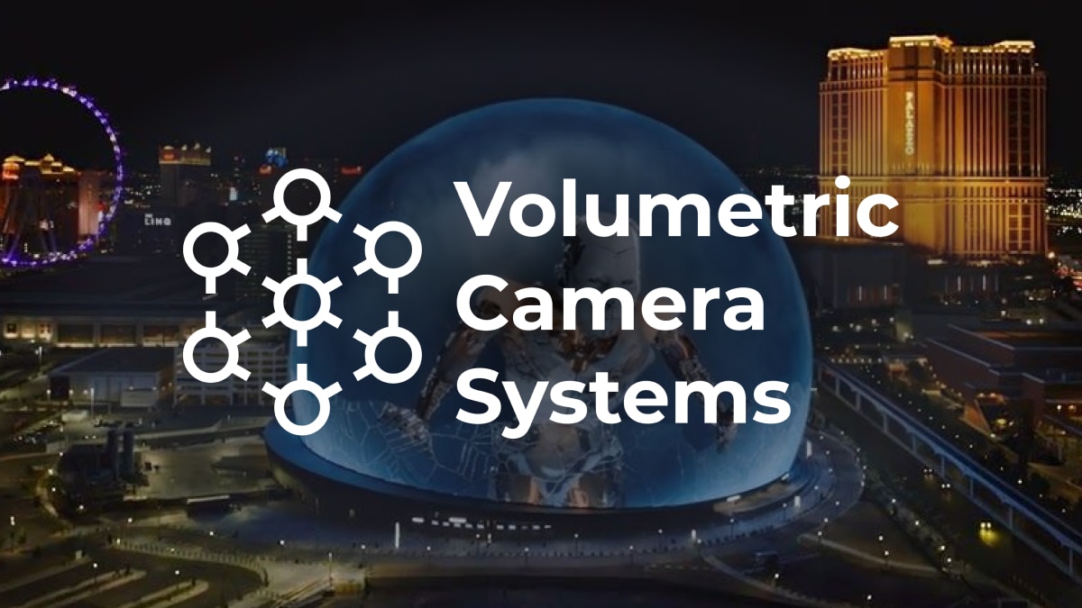 “Volumetric Camera Systems” logo over night city skyline with illuminated dome and buildings.