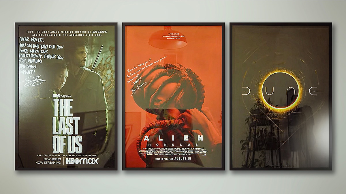 Three framed posters: “The Last of Us” HBO Max, “Alien Romulus,” and “Dune,” each with distinct artwork and lighting tones