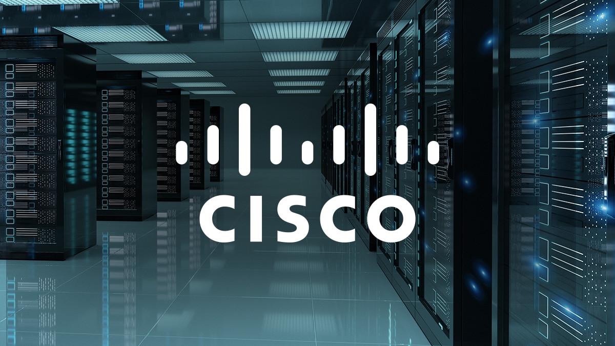 Blue-lit data center aisle with server racks and large Cisco logo overlay on network infrastructure scene