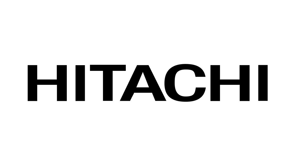 Woman using a laptop at night with HITACHI text overlay on a dark blue background.