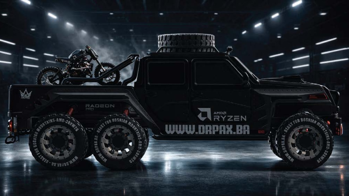Black six-wheel off-road truck concept with motorcycle in the bed and Ryzen branding, shown in a studio setting.