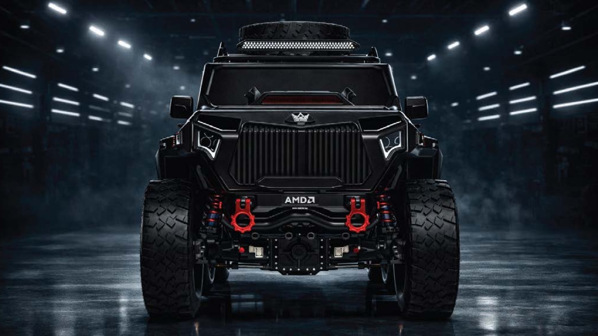 Front view of a rugged six-wheel off-road truck with oversized tires, roof lights, and red recovery hooks.