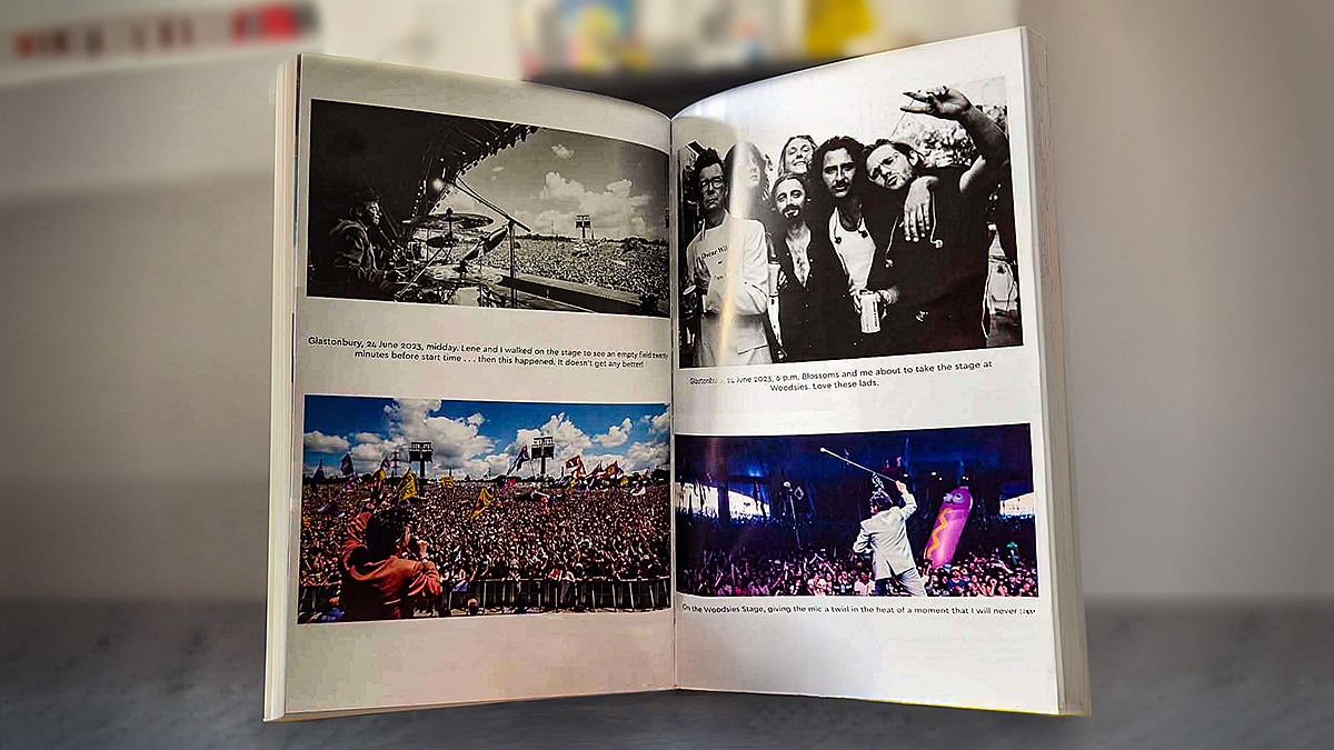 Open photography book displaying concert and backstage photos with printed captions across a two-page spread.