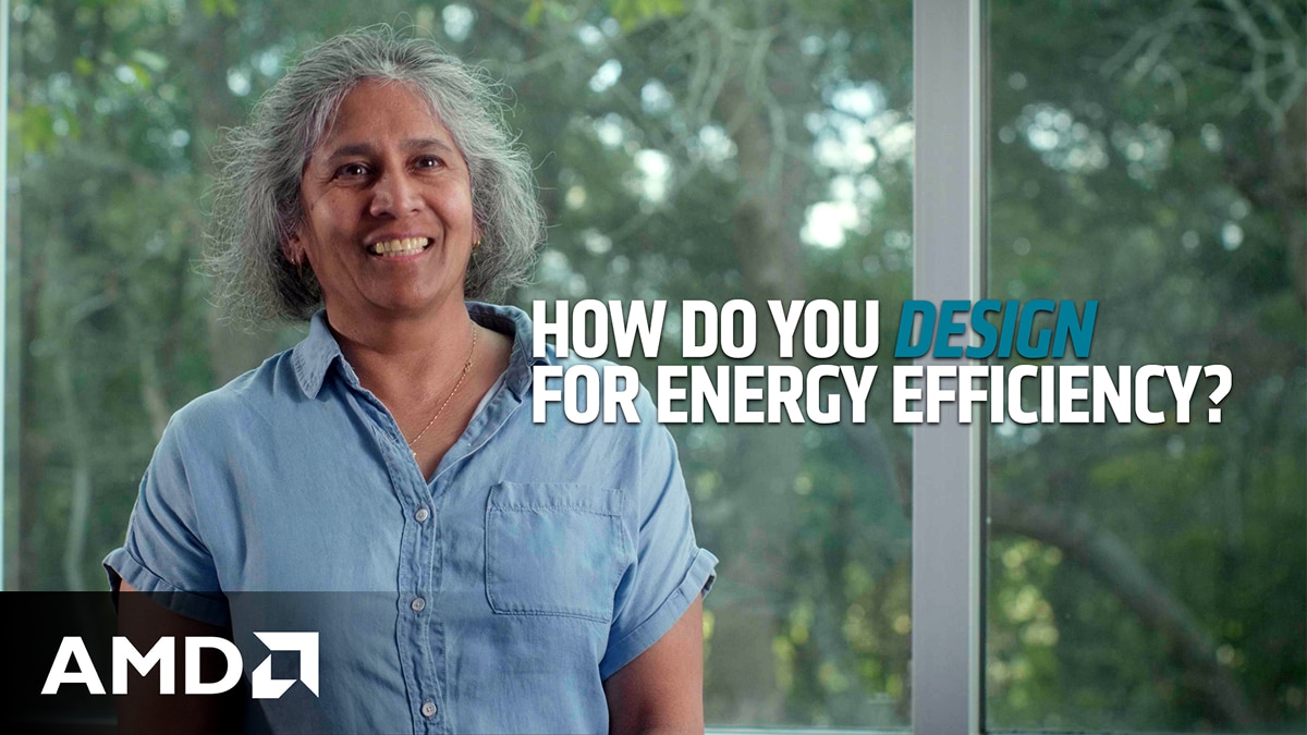 Smiling woman indoors by window with greenery; on-screen text “How do you design for energy efficiency?” and AMD logo.