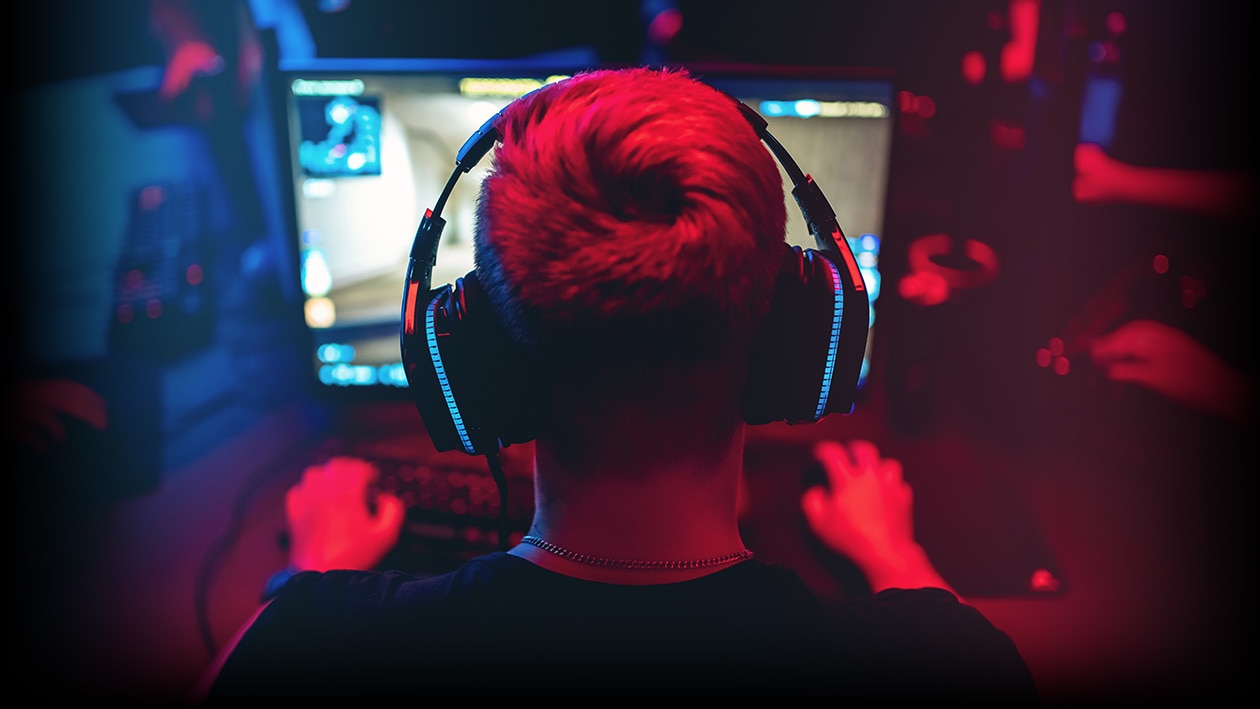 Man playing video game on AMD computer