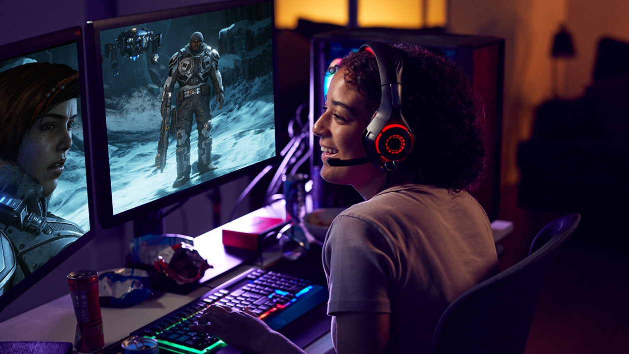Woman playing video game on computer