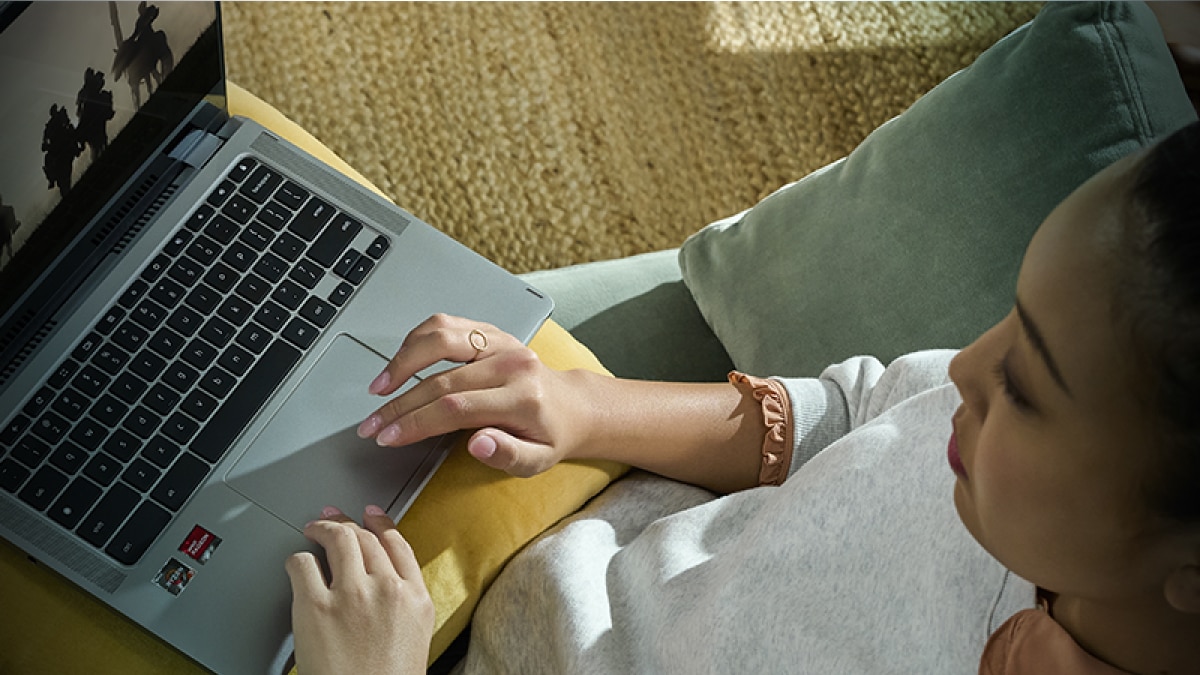 woman watching a movie on a laptop woman watching a movie on a laptop
