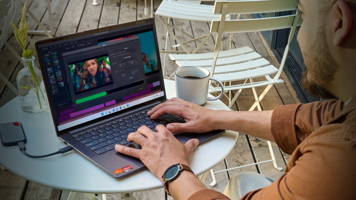 man editing video on laptop man editing video on laptop