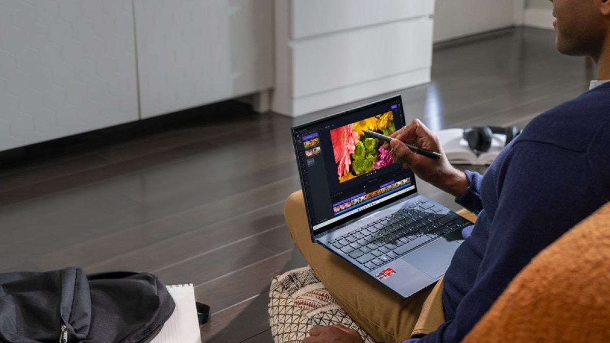Man working on a laptop equipped with AMD Ryzen processor