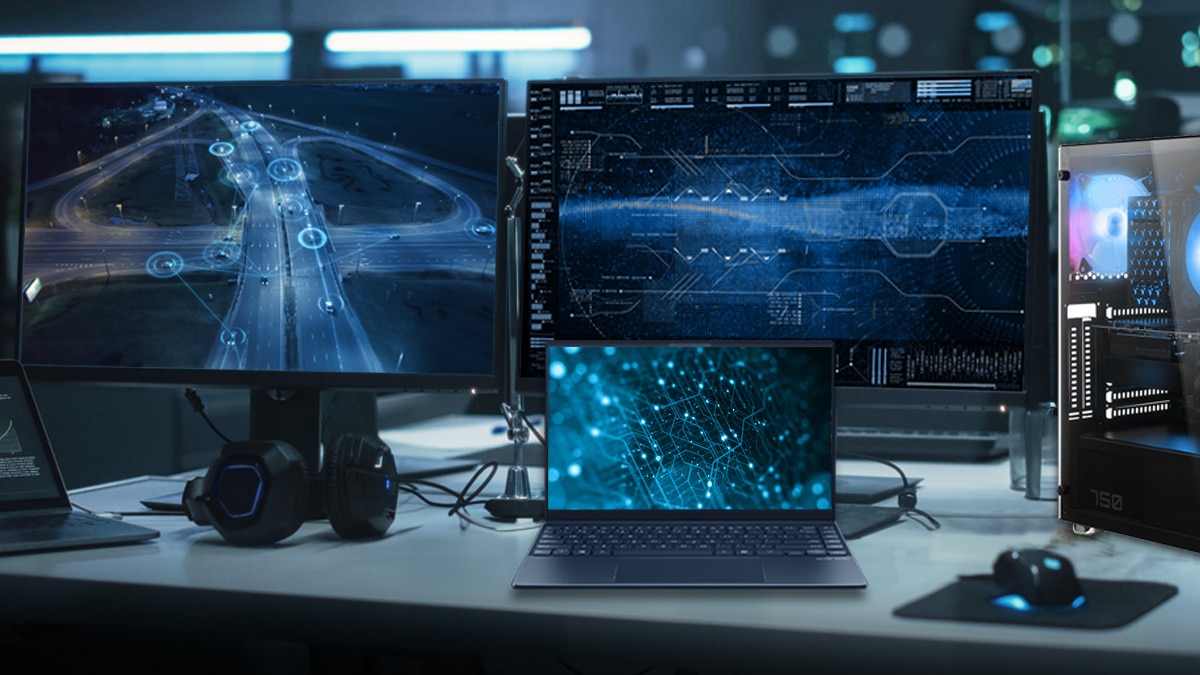 Desk with Laptop and Multiple Computer Screens