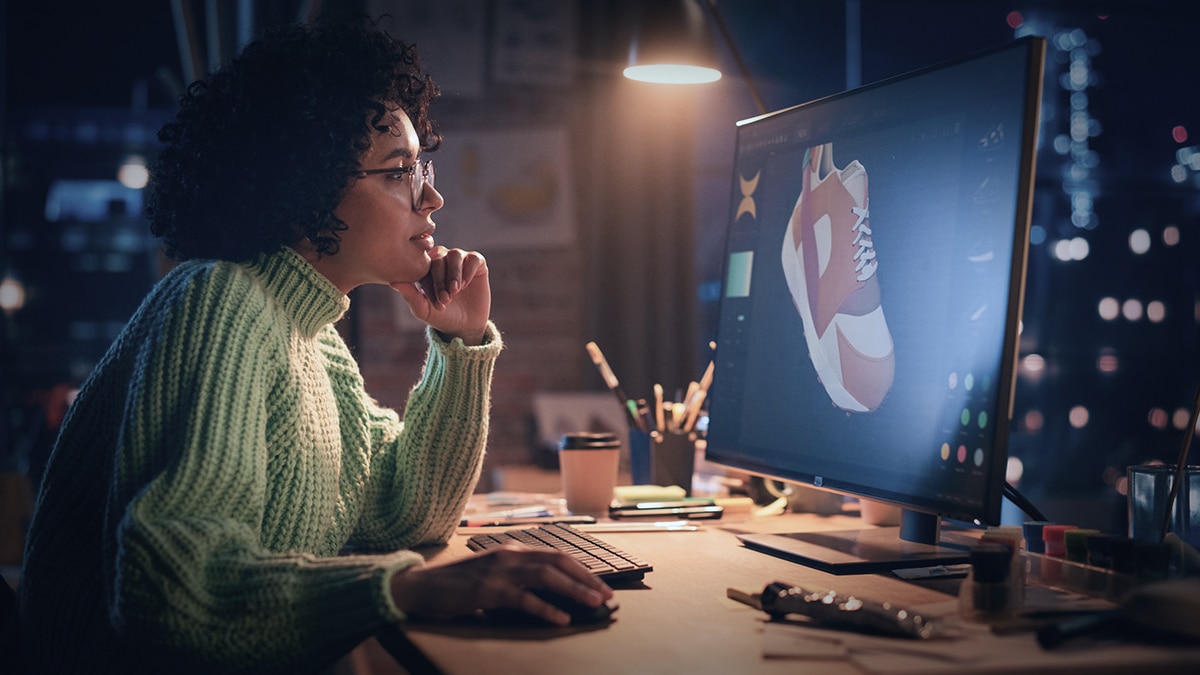 woman creating 3d looking at computer monitor