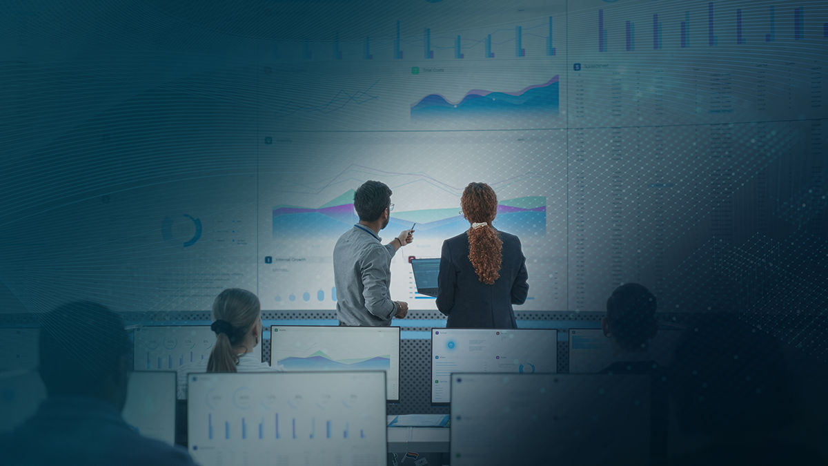Two analysts presending data to a class 