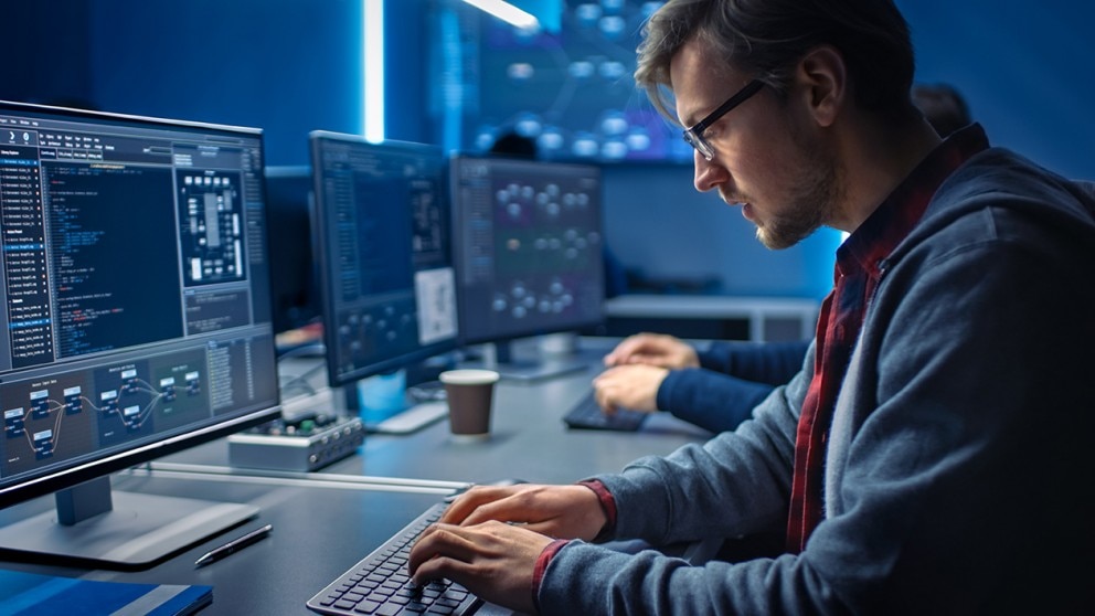 Man working at a computer Man working at a computer