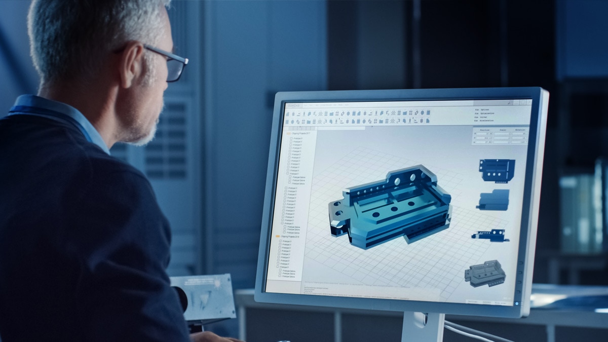 Engineer Works on Computer Uses CAD Software to Design 3D Industrial Machinery Component