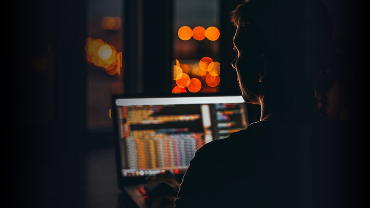 man working on a laptop computer