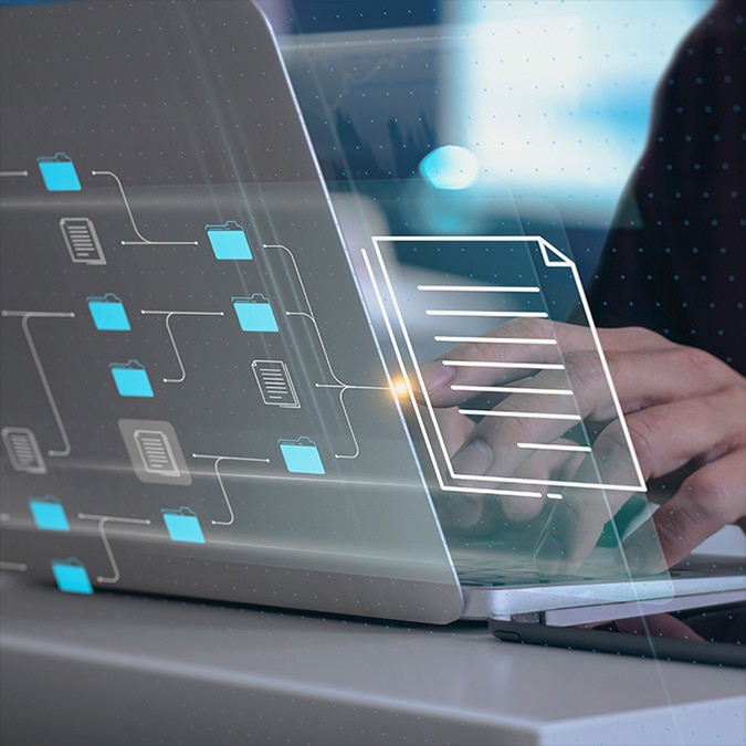 Close-up of hands using a laptop with illustration of file system