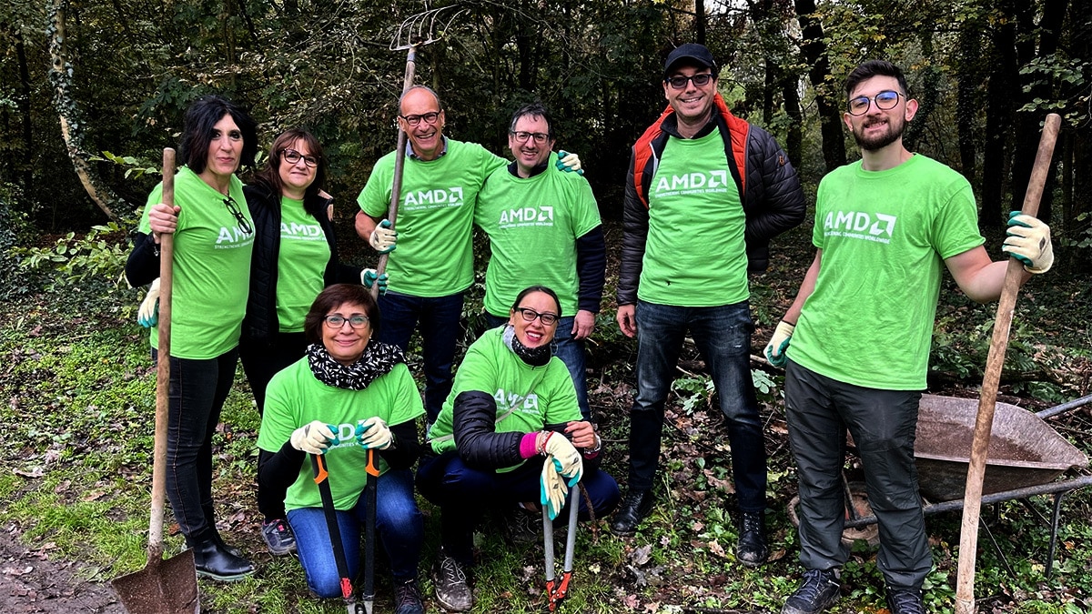 AMD volunteers holding landscaping tools