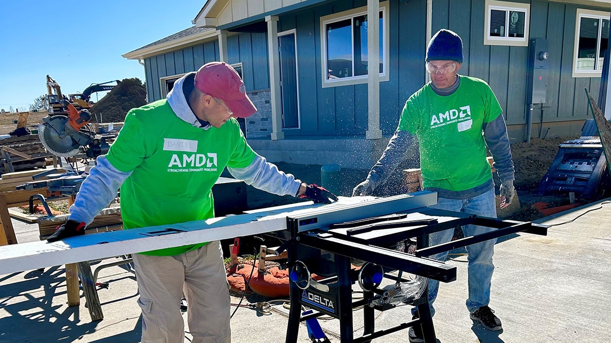 AMD volunteers working on a house