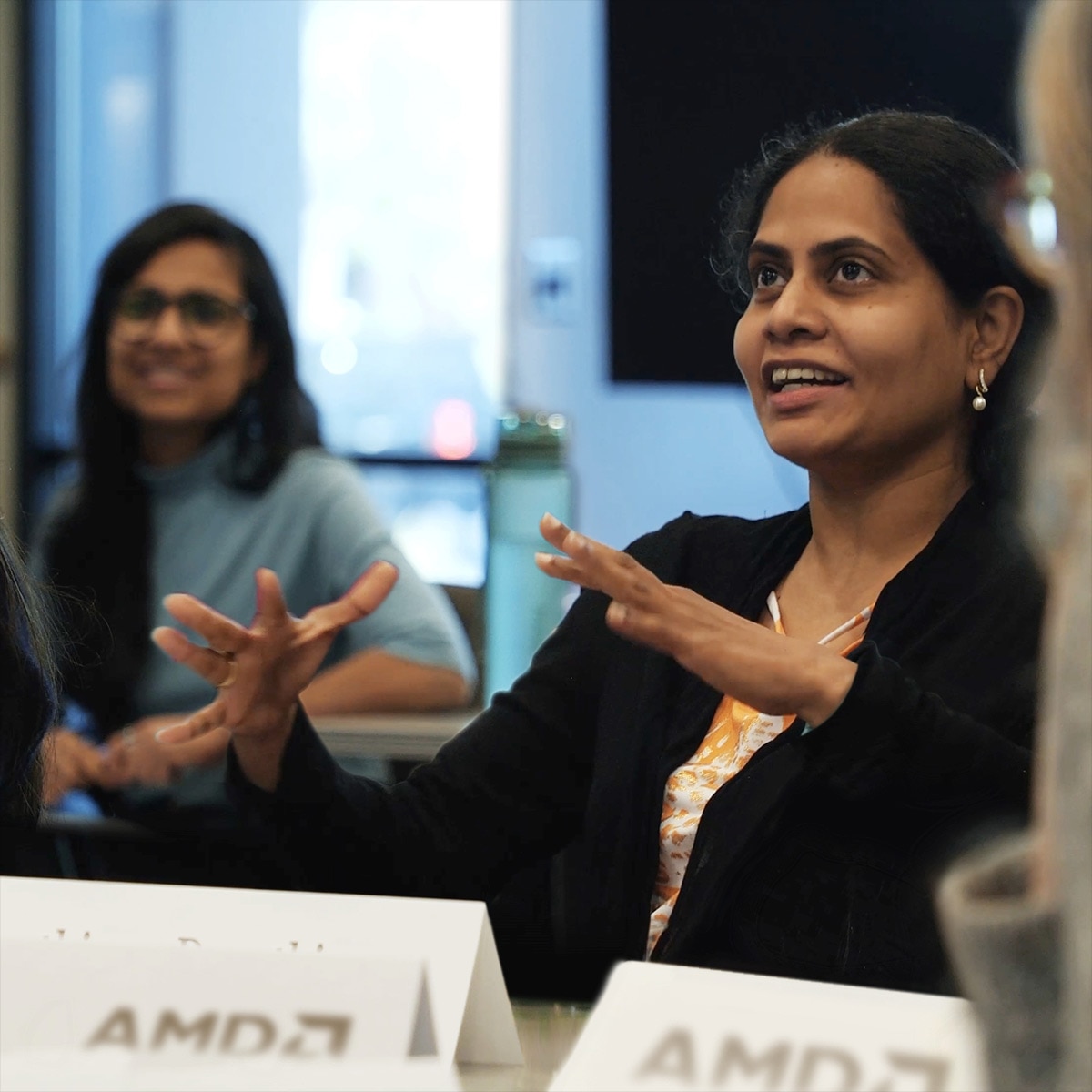 Woman speaking at AMD event