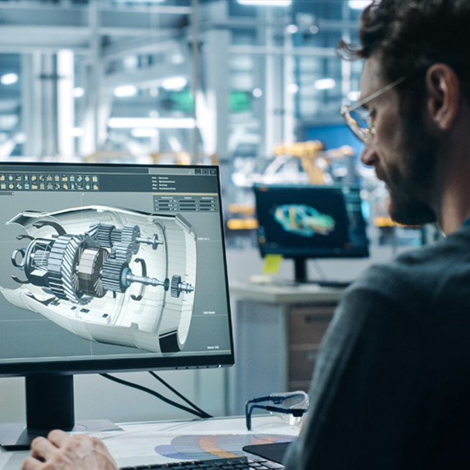 Engineer Working on Turbine Prototype on Computer