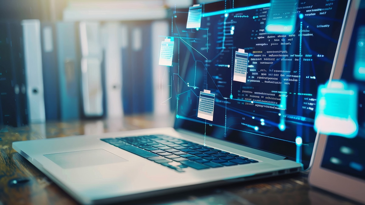 Laptop with file oranization graphic overlay