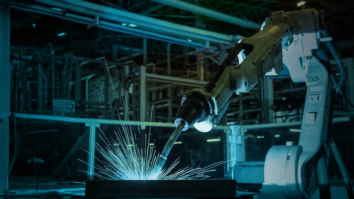 Robotic arm welding in a factory