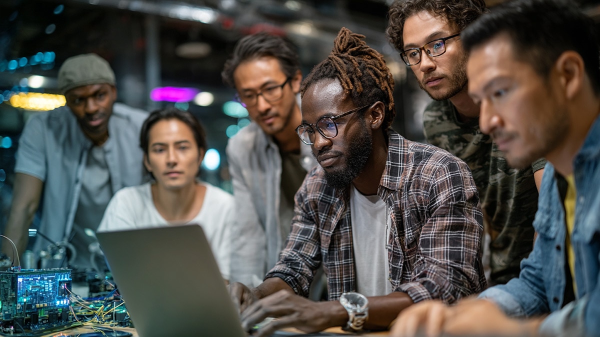 Engineers collaborating at a high-tech innovation workshop