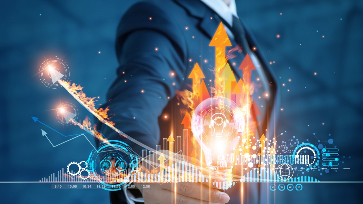 Drive Profitability with AMD Image showing a growth chart graph and man in suit behind it