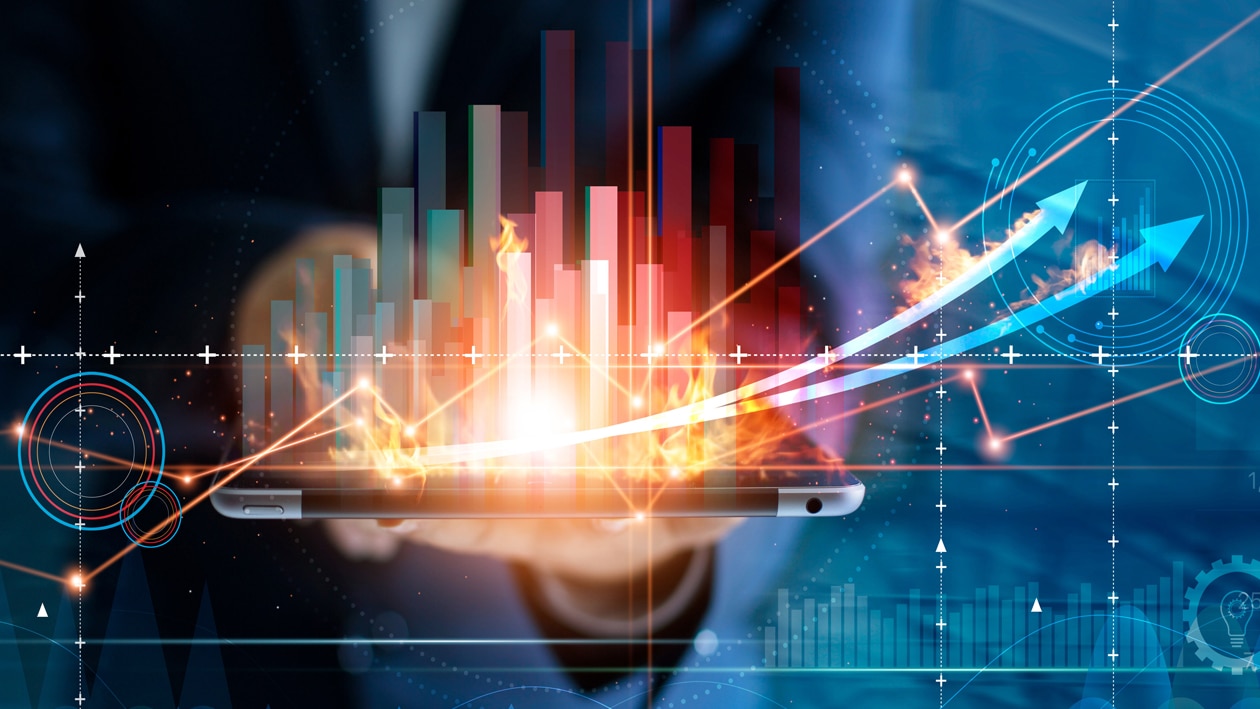 Grow Your Business with AMD Image showing a growth chart graph and man behind it