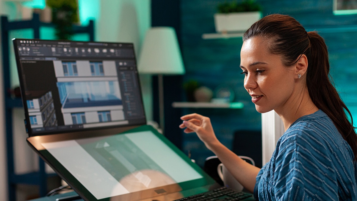 Woman doing creative design work on laptop